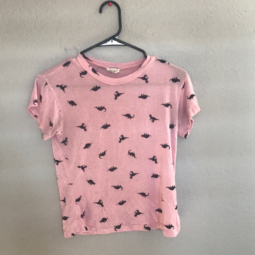 A pink dinosaur short sleeve shirt